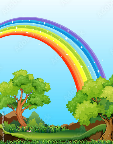 Nature forest view with rainbow in the sky scene