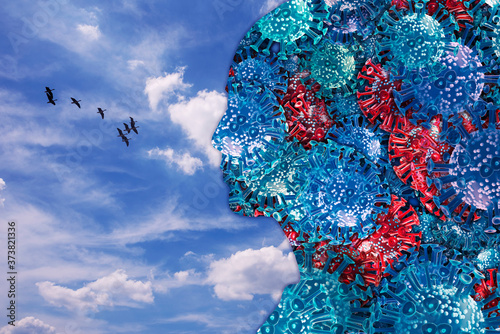 A flock of corona viruses and free birds flying through the blue sky. Combination of 3d rendering and photography