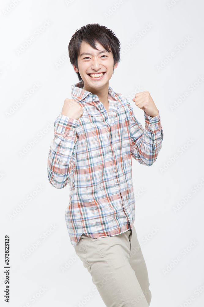 ガッツポーズをする男性 ガッツポーズをする男性