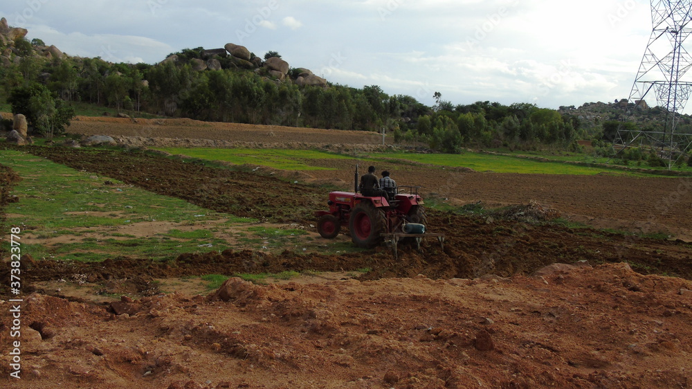 Fototapeta premium man riding a tractor