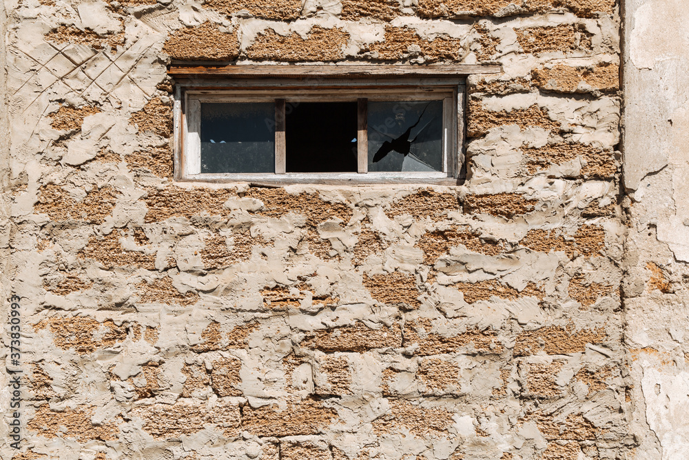 Broken glass in a building window. Housing problems Broken glass in a building window. Housing problems