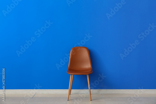 Fototapeta Naklejka Na Ścianę i Meble -  Modern chair near color wall