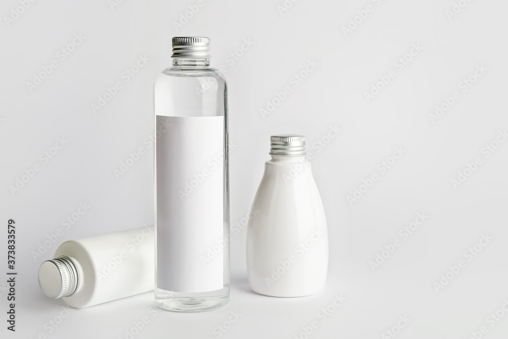 Different cosmetic products on light background Different cosmetic products on light background