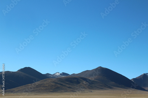 View of Tanggula Mountains and blue sky near Namtso in Tibet, China
