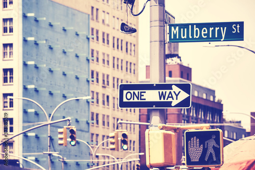 New York City street signs and traffic lights by Mulberry Street, once the heart of Manhattan Little Italy, Color toned picture, USA. photo
