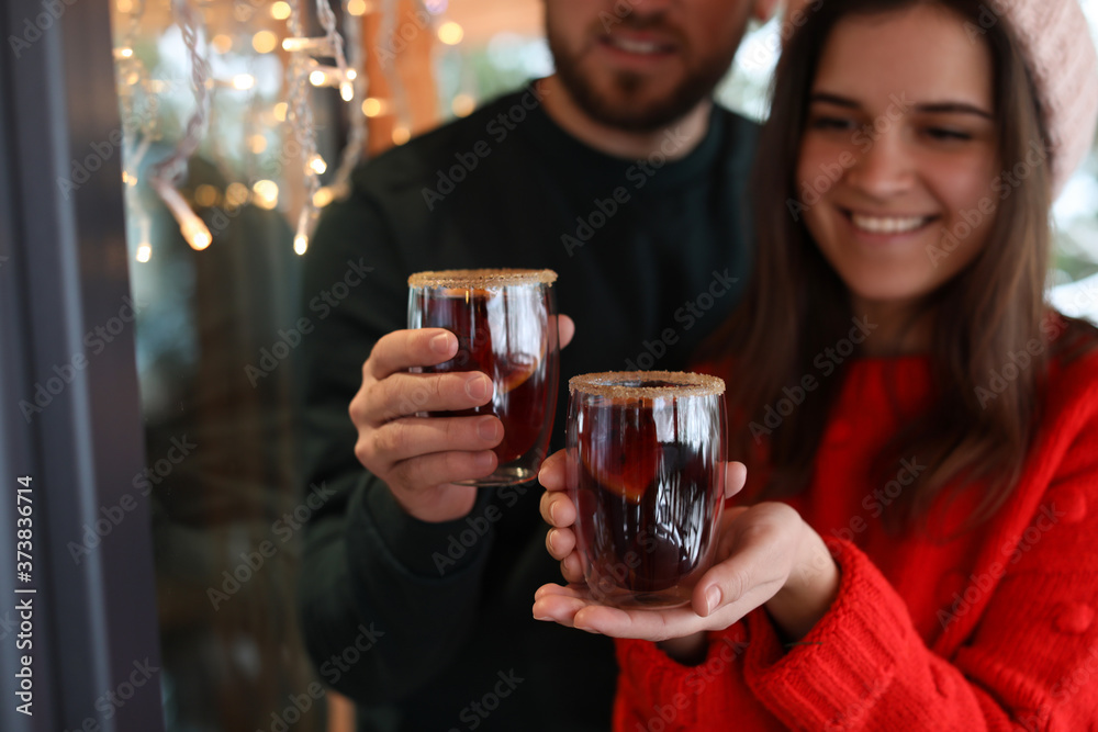 Lovely couple with tasty mulled wine outdoors, focus on hands Lovely couple with tasty mulled wine outdoors, focus on hands
