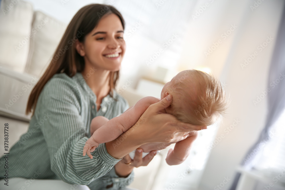 Mother with her newborn baby at home Mother with her newborn baby at home