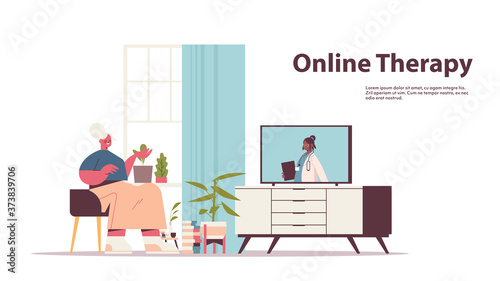 senior woman watching online video consultation with female doctor on tv screen healthcare telemedicine medical advice concept full length horizontal copy space vector illustration