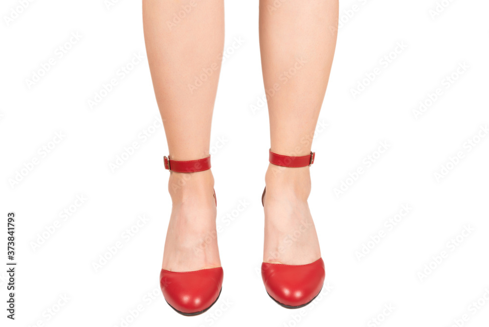 Woman legs in retro red sandals on heels. Woman legs in retro red sandals on heels.