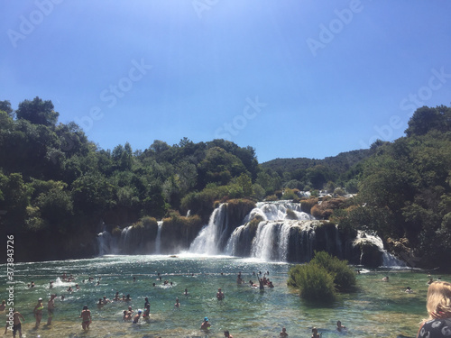 Groups of people swimming in Krka falls, Croatia