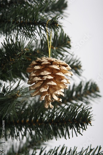 Pine cone hanging on christmas tree