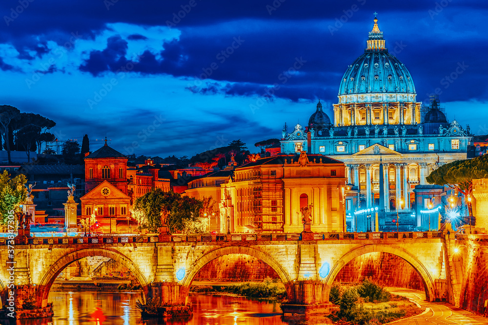 Fototapeta premium View on Bridge Vittorio Emanuele II (Ponte Vittorio Emanuele II) and Vatican city St. Peter's Basilica (Basilica di San Pietro) at night time. Rome. Italy.