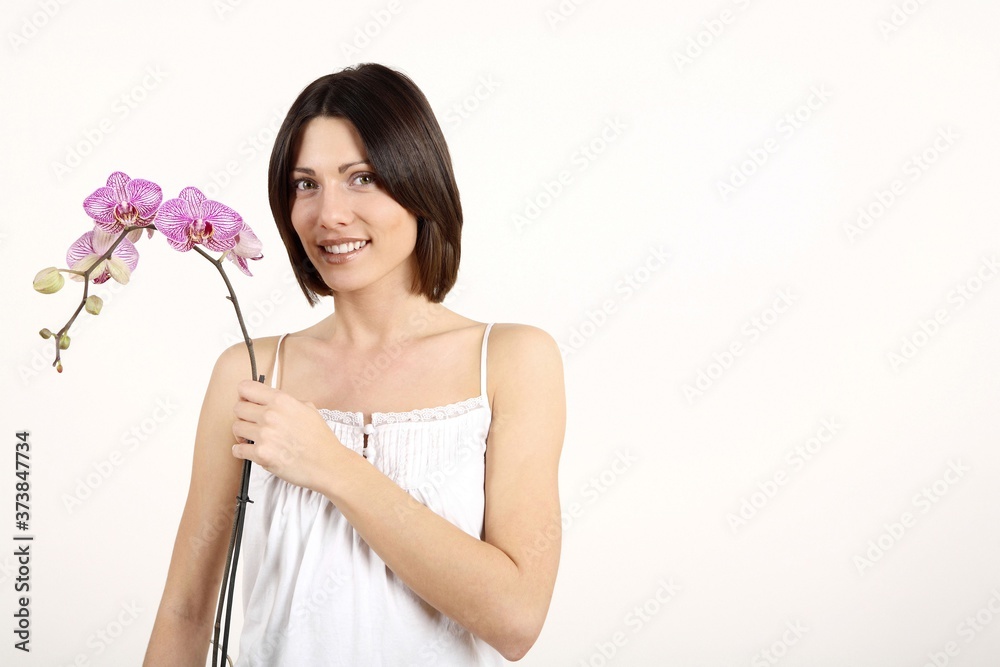 Woman holding orchid