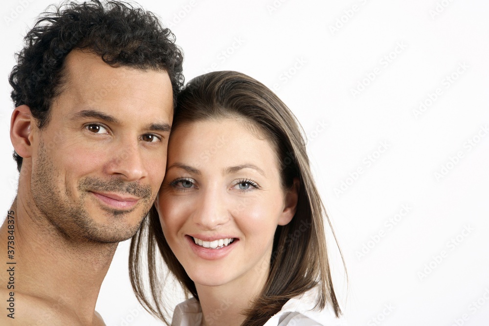 Man and woman smiling and looking at the camera Man and woman smiling and looking at the camera