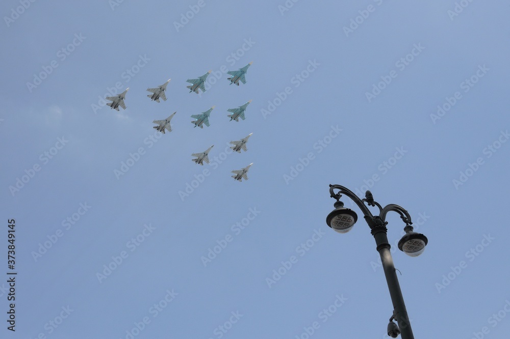 Tactical wing consisting of a group of su-30SM and su-35S fighters and SU-34 bombers in the sky over Moscow during the dress rehearsal of the Victory parade Tactical wing consisting of a group of su-30SM and su-35S fighters and SU-34 bombers in the sky over Moscow during the dress rehearsal of the Victory parade