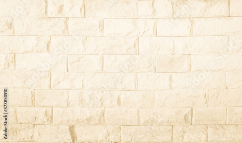Empty Background of wide cream brick wall texture. Brown brick wall texture background in room at subway. Brickwork stonework interior  rock old concrete grid uneven horizontal architecture wallpaper.