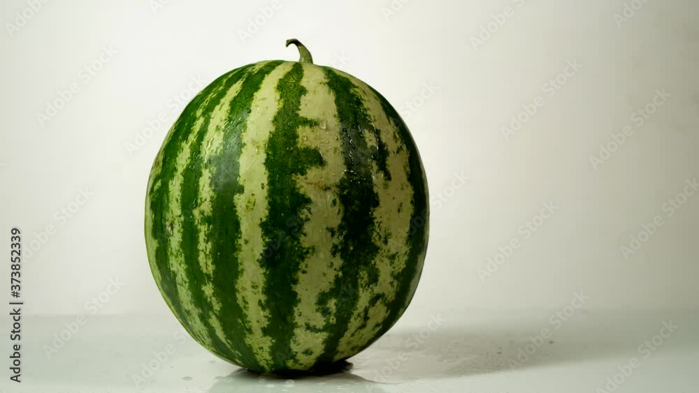 colorfull watermelon with drops of water on the white background colorfull watermelon with drops of water on the white background