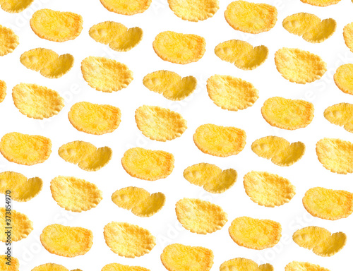 Many tasty corn flakes on white background