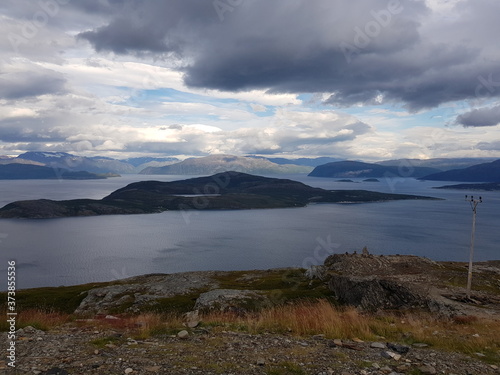 sea and fjord view from the top of the Kvenangsfjellet mountain in Nordreisa  northern Norway
