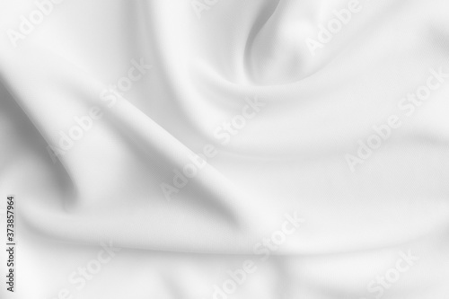 White abstract wavy clothes background. fabric texture photo