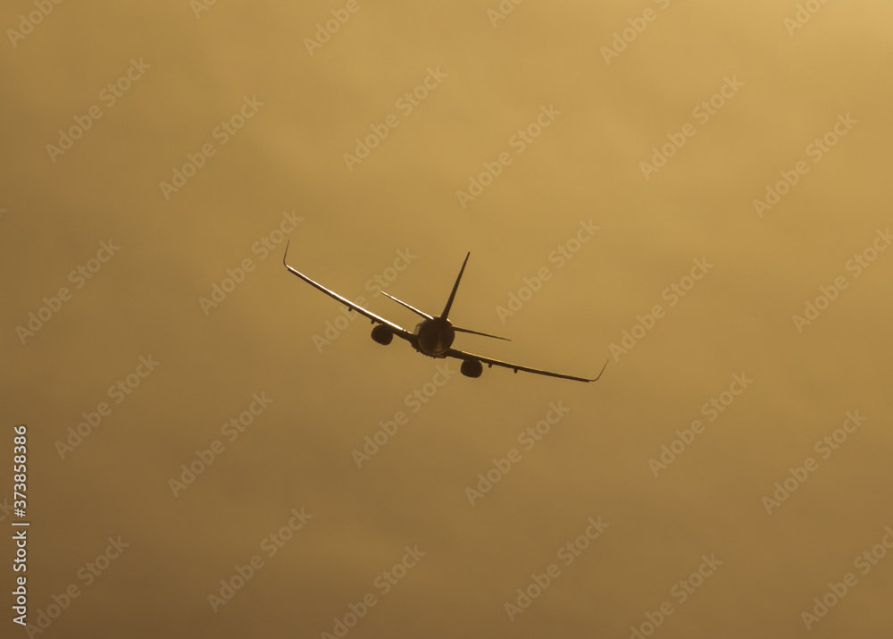 Silhouette of an airplane at sunset. Silhouette of an airplane at sunset.