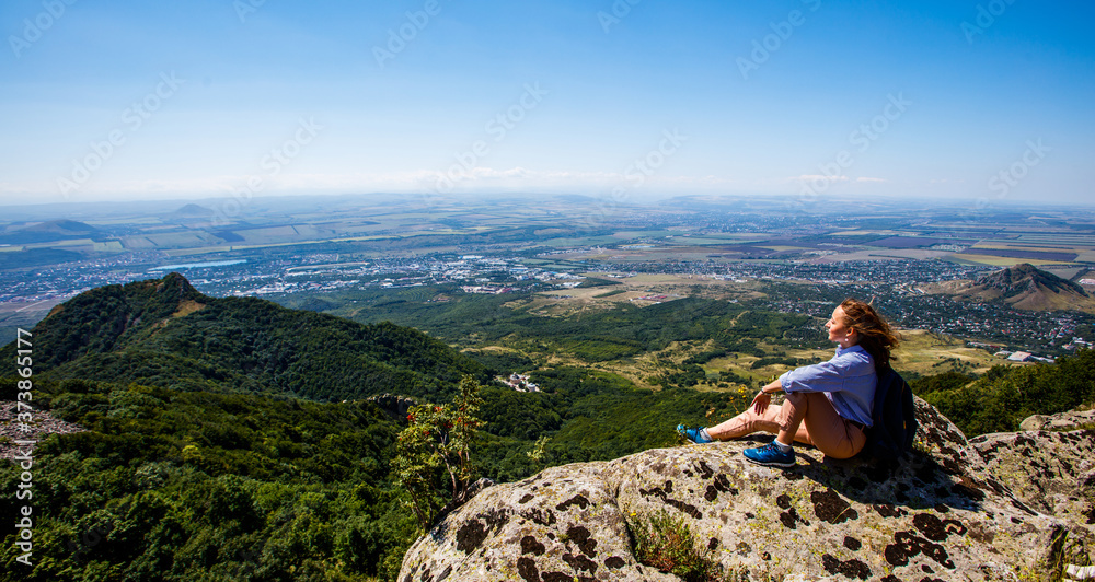Girl admires the views from the mountain