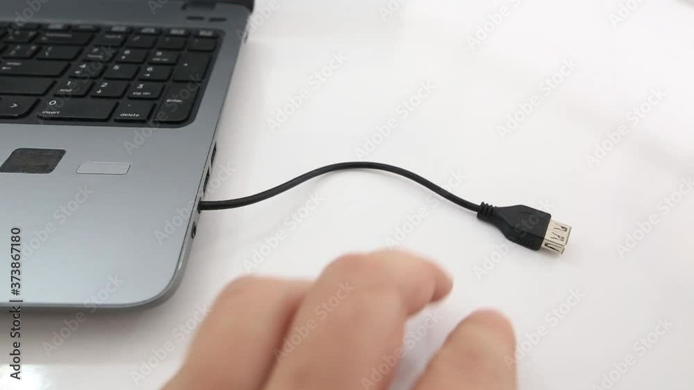 Transfering data concept with bionic hand with cable Transfering data concept with bionic hand with cable