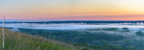 sunrise, fog over the river panorama of the landscape in the early morning. pink sky before sunrise . background image