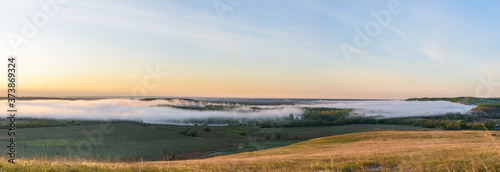 sunrise, fog over the river panorama of the landscape in the early morning. pink sky before sunrise . background image.