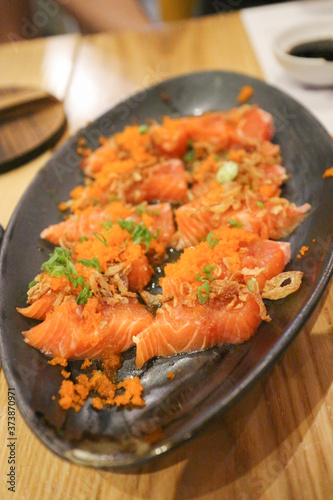 Spicy Salmon on black plate