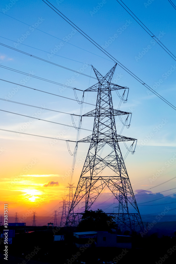 Fototapeta premium high-voltage power lines at sunset,high voltage electric transmission tower