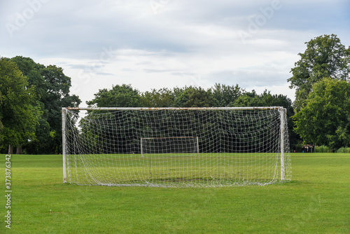Outdoor football pitch with goals and soccer nets in public park