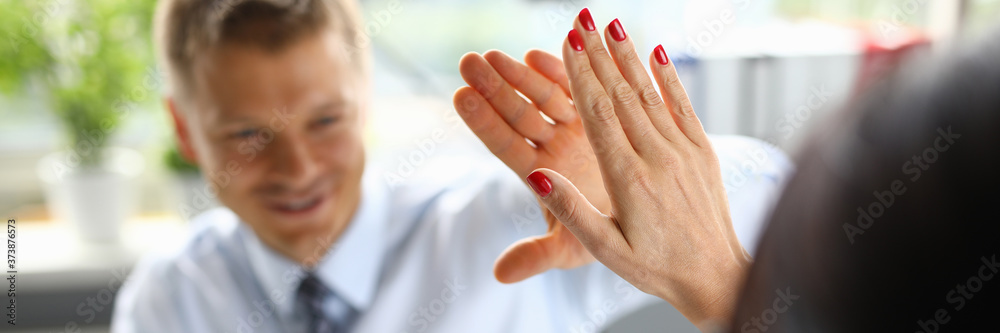 Businessman in an office high five of his colleague a closeup. Successful business arrangement concept Businessman in an office high five of his colleague a closeup. Successful business arrangement concept