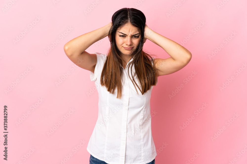 Young caucasian woman isolated on pink background frustrated and covering ears Young caucasian woman isolated on pink background frustrated and covering ears