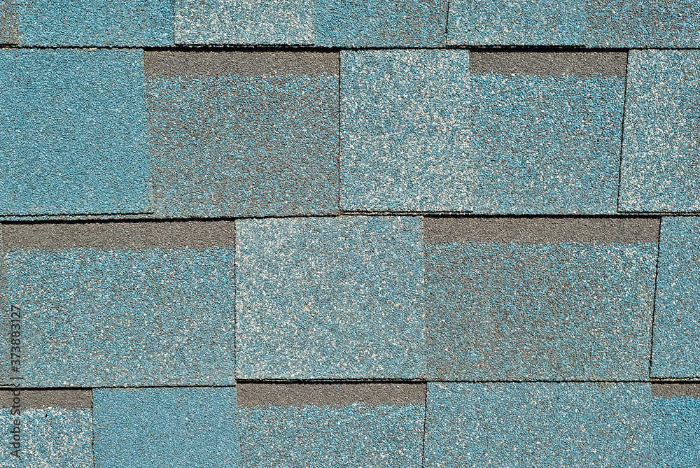 Obraz premium Flexible tile is made of fiberglass impregnated with bitumen. Blue roof texture close up.