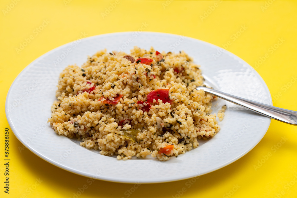 fresh vegetable salad with couscous on the plate fresh vegetable salad with couscous on the plate