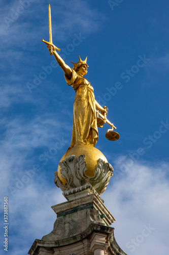 Lady Justice Statue at The Old Bailey in London, UK photo