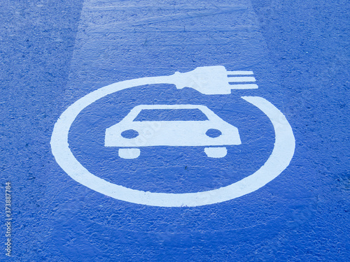 ground signs indicating electric car supply point photo