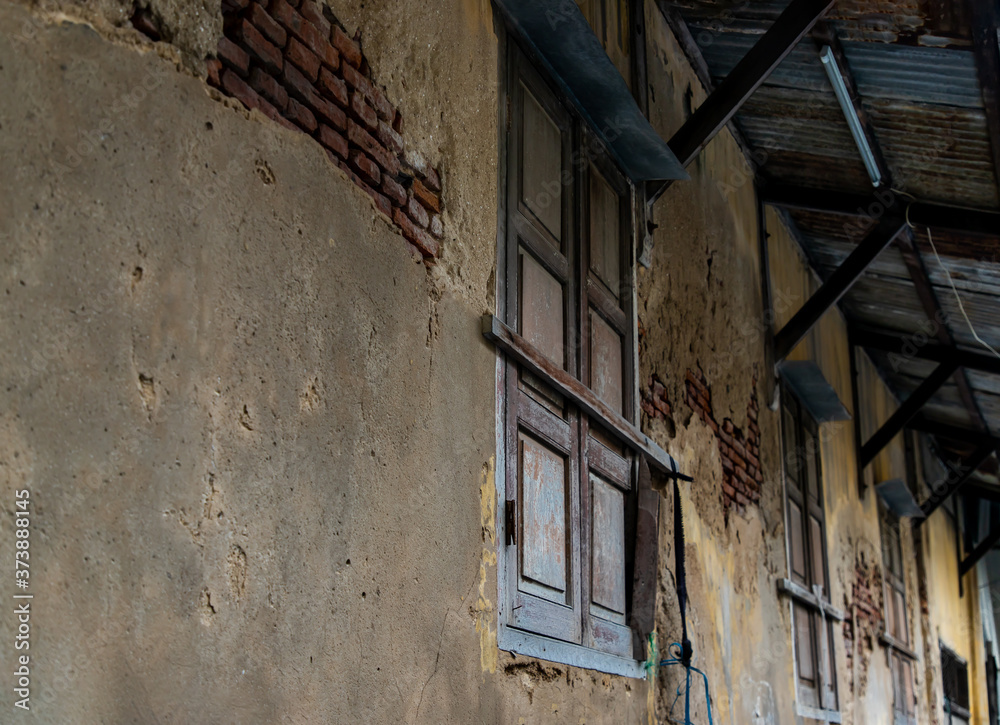 Old wooden windows on the old wall. Traditional Architecture style, Selective focus.