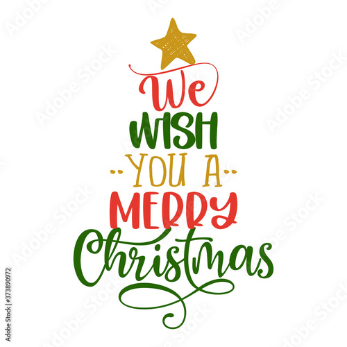We wish you a Merry Christmas - Calligraphy phrase in Christmas tree shape. Hand drawn lettering for Xmas greetings cards, invitations.