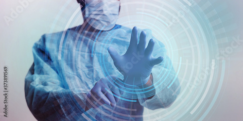 Doctor in mask putting on protective gloves, hologram circles