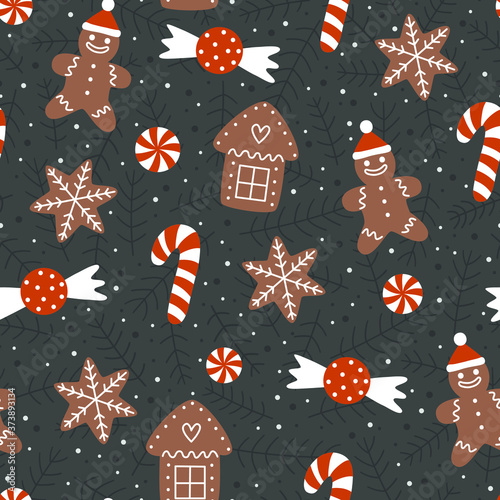 Seamless pattern with Christmas gingerbread cookies. Christmas house, snowflake, gingerbread man and candy cane.