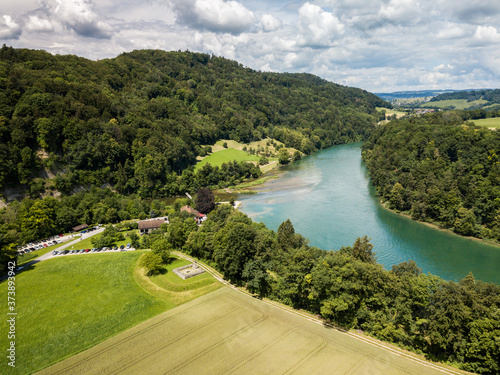 Aerial drone image of Rhine sinuosity or loop at Toesegg with an ancient watch tower ruin from Roman times, Canton Zurich, Switzerland photo