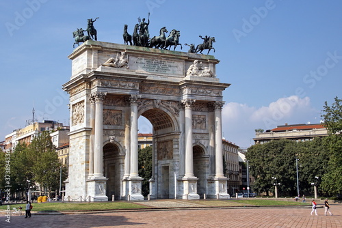 Sempione Park (Parco Sempione) in Milan with Tourists, Italy. View on Arch of Peace (Arco della Pace).