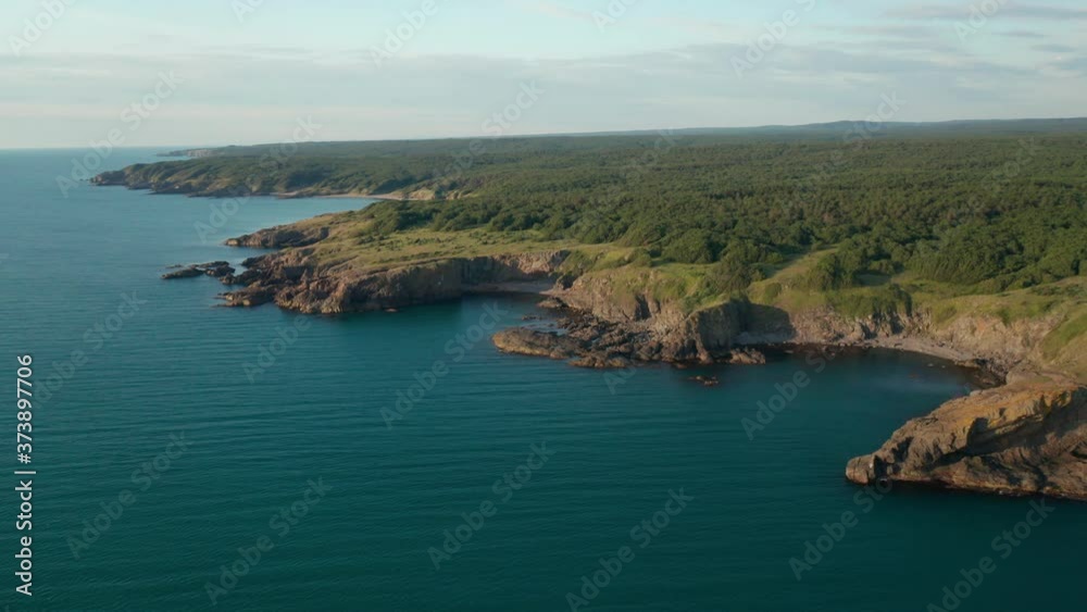 Drone flight around a picturesque rocky coastline with small wild beaches and green meadows on the southern coast of the Black Sea, Bulgaria Drone flight around a picturesque rocky coastline with small wild beaches and green meadows on the southern coast of the Black Sea, Bulgaria