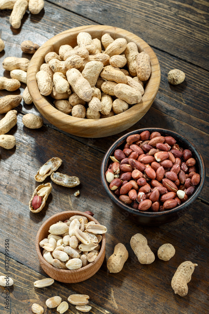 Peeled and unpeeled peanuts. Peeled and unpeeled peanuts.