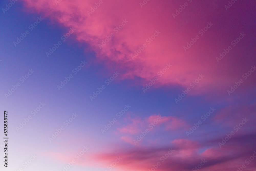 Blue pink sunset sky. Nature multicolored beautiful background.