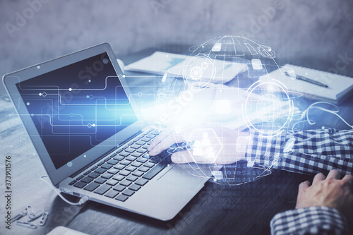Social network theme hologram with businessman working on computer on background. Concept of world wide web. Double exposure.