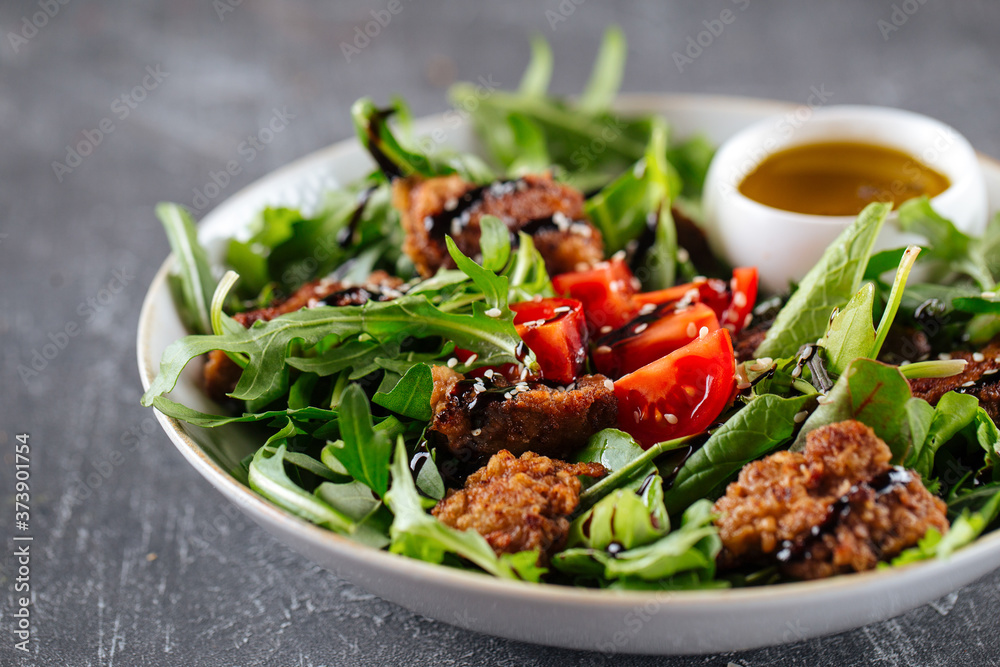 Gourmet salad with fried meat and greens Gourmet salad with fried meat and greens