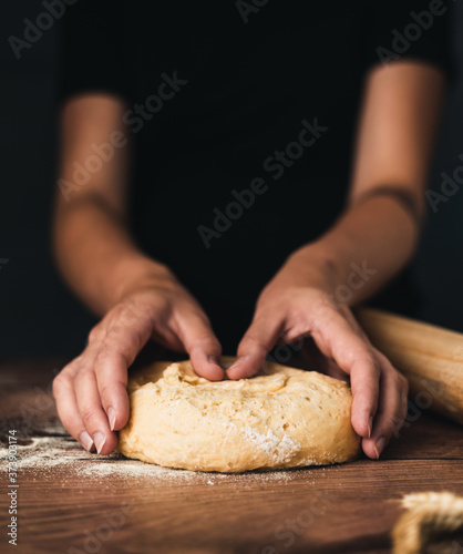 woman kneading dough